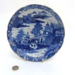 An oriental style blue and white dish.