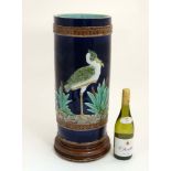 A 19thC Joseph Holcroft majolica umbrella / stick stand decorated with heron / storks on a cobalt