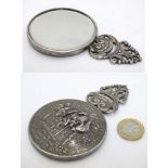 A small hand mirror with Continental hunting party decoration.