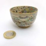 A small Japanese Satsuma bowl depicting a wintery mountainous garden landscape with oriental