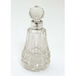 A cut glass perfume / scent bottle with silver collar. Hallmarked Birmingham 1908 William J Holmes.