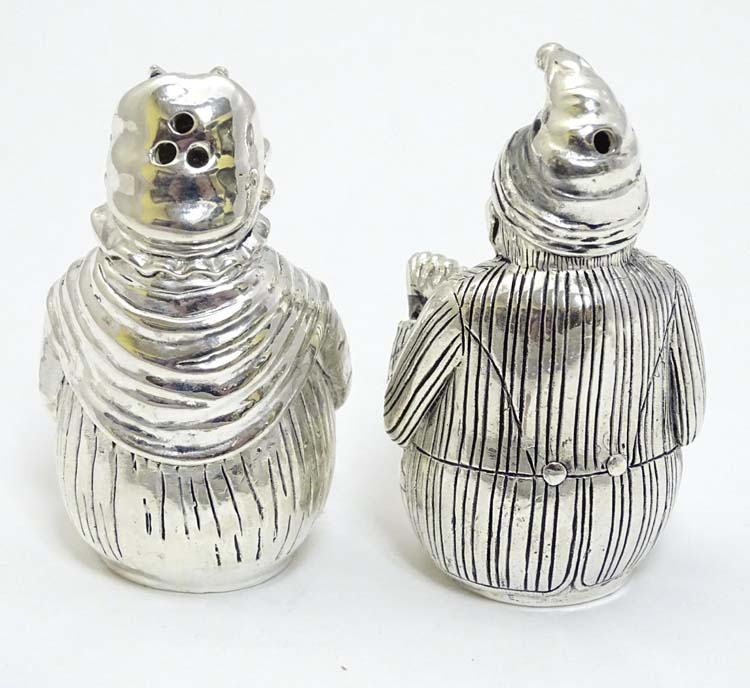 A pair of white metal novelty pepperettes formed as Punch and Judy figures. - Image 4 of 5