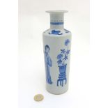 A Chinese Blue and White vase of tall cylindrical form with waisted neck and flared rim,