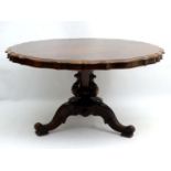 n impressive early-mid 19thC rosewood tilt top breakfast table with a scallop edged top and trumpet