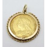 1/2 Sovereign : A Victoria 1901 , 1/2 Sovereign with Hall Marked 9 ct captive mount pendant .