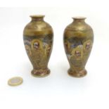 A pair of miniature Japanese Satsuma baluster vases decorated with figures with gilt highlights ,