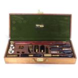 Shooting: A William Powell presentation shotgun cleaning kit, of figured walnut construction,