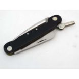 A rare Cammilus pocket knife, of carbonitride titanium and Japanese steel construction,