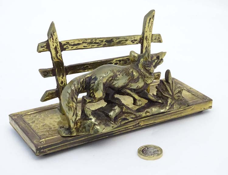 A novelty letter rack with brass fox and fence decoration.