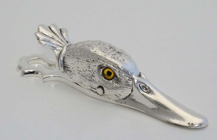 A silver plate desk top letter clip in the form of a ducks head. 21stC.