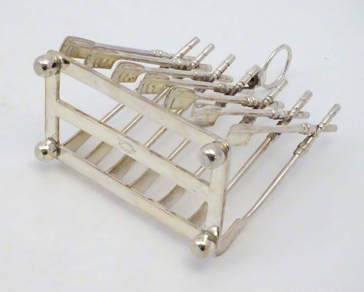 Rowing: A novelty 6-slice silver plated toast rack, the bars formed as oars. - Image 11 of 14