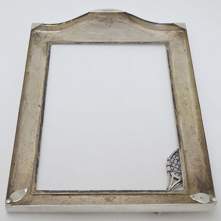 A silver photograph frame surround with tennis racket motif. Marked Sterling . - Image 5 of 6