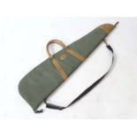 Shooting : A ' Klever sport ' gun / ' scoped rifle slip , green synthetic finish with leather trim ,