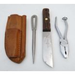 A Yachtsman's three piece rigging kit , comprising knife (by J Nowill), needle and pliers,