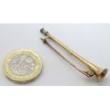 A 15ct gold stock pin formed as a hunting horn 2" long