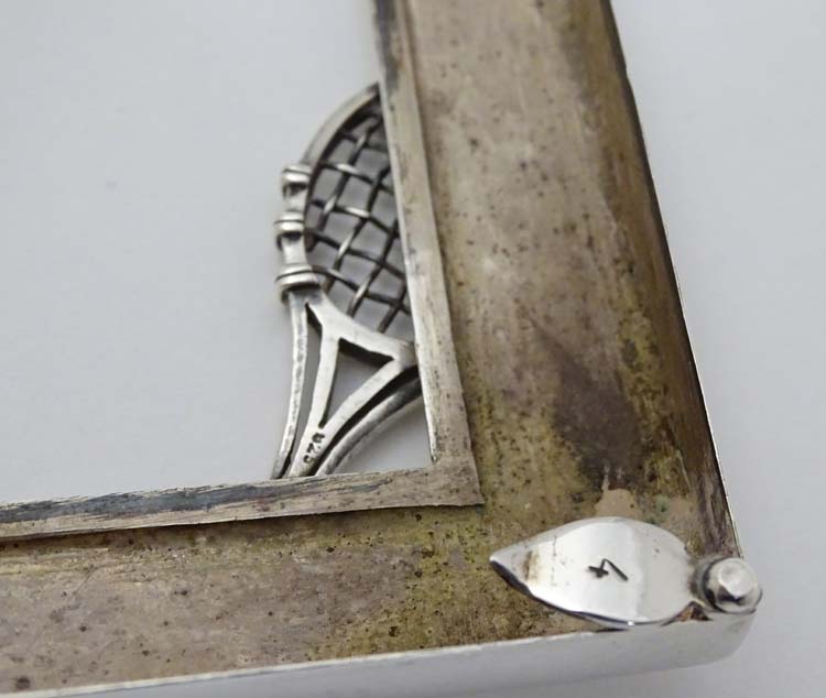 A silver photograph frame surround with tennis racket motif. Marked Sterling . - Image 2 of 6