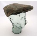 Country clothing : A tweed flat cap by Marlin , green plaid overall with lean sky blue ,