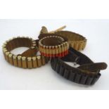 Shooting: A collection of four vintage leather cartridge belts,