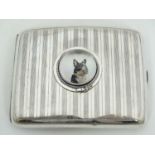 A silver cigarette case hallmarked Birmingham 1921 with later applied Essex Crystal Cabochon