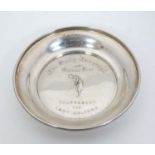 Golfing interest ( Lady Golfers): A silver pin dish / trophy with embossed image of a female golfer