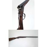 Shotgun : A 12 bore Side by side boxlock , of Spanish origin ,