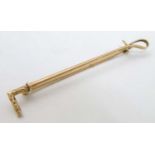 Equine / Horse Riding Interest : A yellow metal stick pin formed as a riding crop / whip 2 1/4"