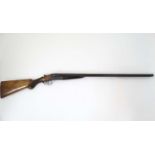 Shotgun : A 12 bore Side by side boxlock , of Belgian origin ,