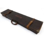 Shooting: An early to mid 20thC leather and brass cornered motor case,