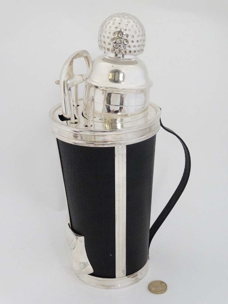 A late 20thC Novelty cocktail set formed as a golf bag containing four swizzle sticks formed as