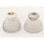 Two cut glass inkwells having silver plated hinged tops with later applied cabochons depicting dogs