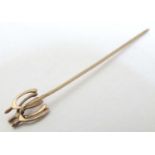 Equine / horse Riding Interest : A yellow metal stick in surmounted by 3 wishbones 2" long overall