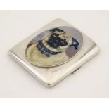 A silver cigarette case having later applied 21stC enamel decorated cabochon depicting a pug dog.