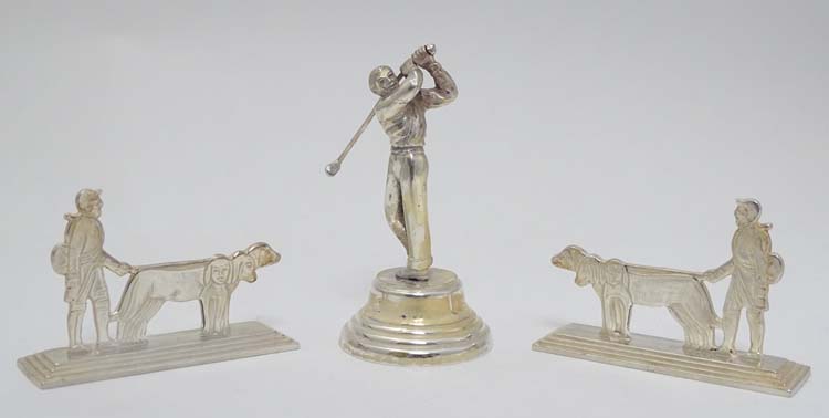 A pair of Art Deco style silver plate knife rests formed as huntsman with dogs 3 1/4" wide Together