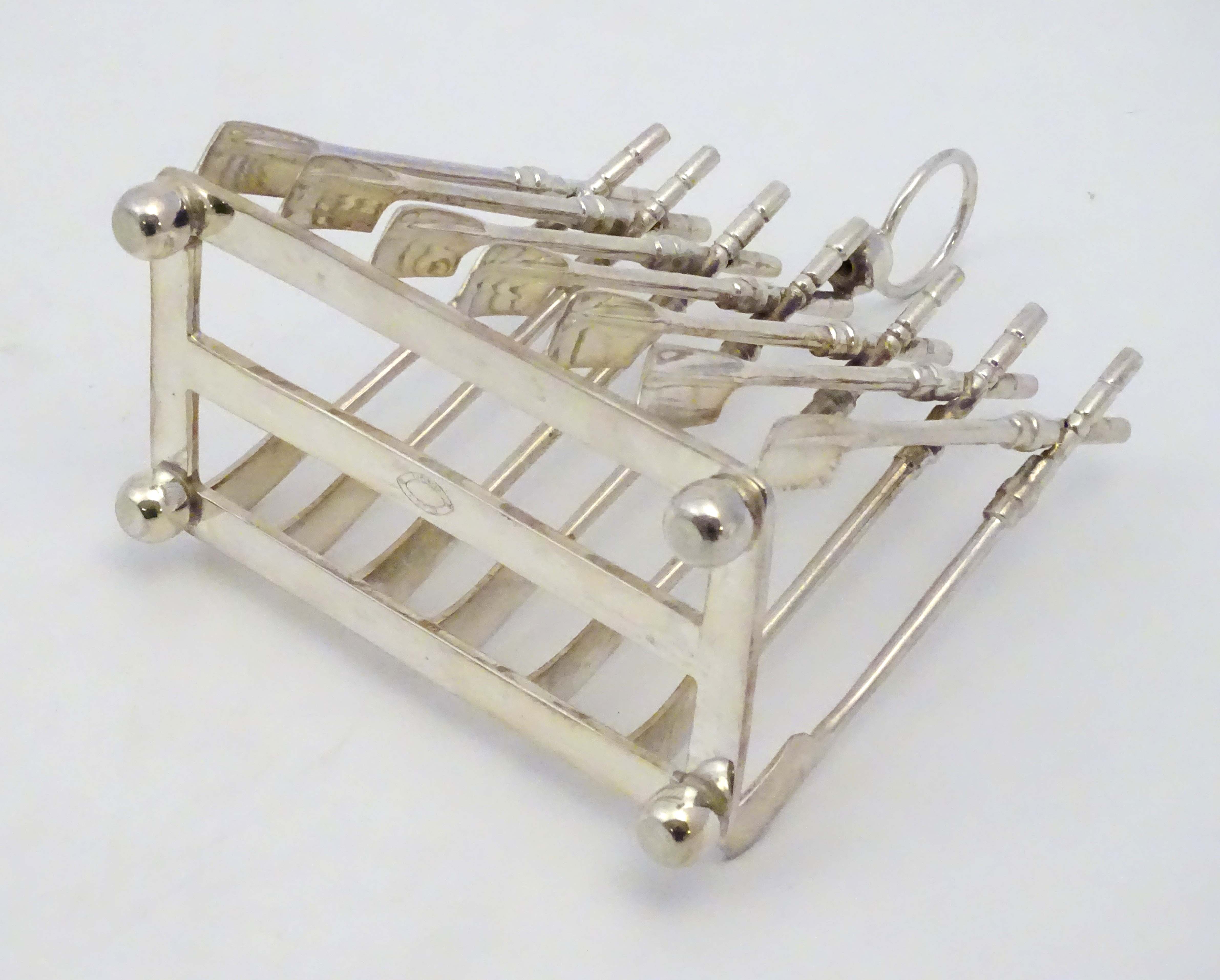 Rowing: A novelty 6-slice silver plated toast rack, the bars formed as oars. - Image 10 of 14