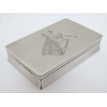 A Geo VI silver box with engine turned and engraved horse head decoration.