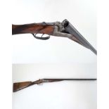 Shotgun : A 12 bore Side by side boxlock , of Spanish origin ,