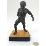 A mid 20thC cast metal model of a footballer? Probably Russian. On wooden base.