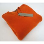 A Laksen Astor knit shooting jumper in orange, size XL,