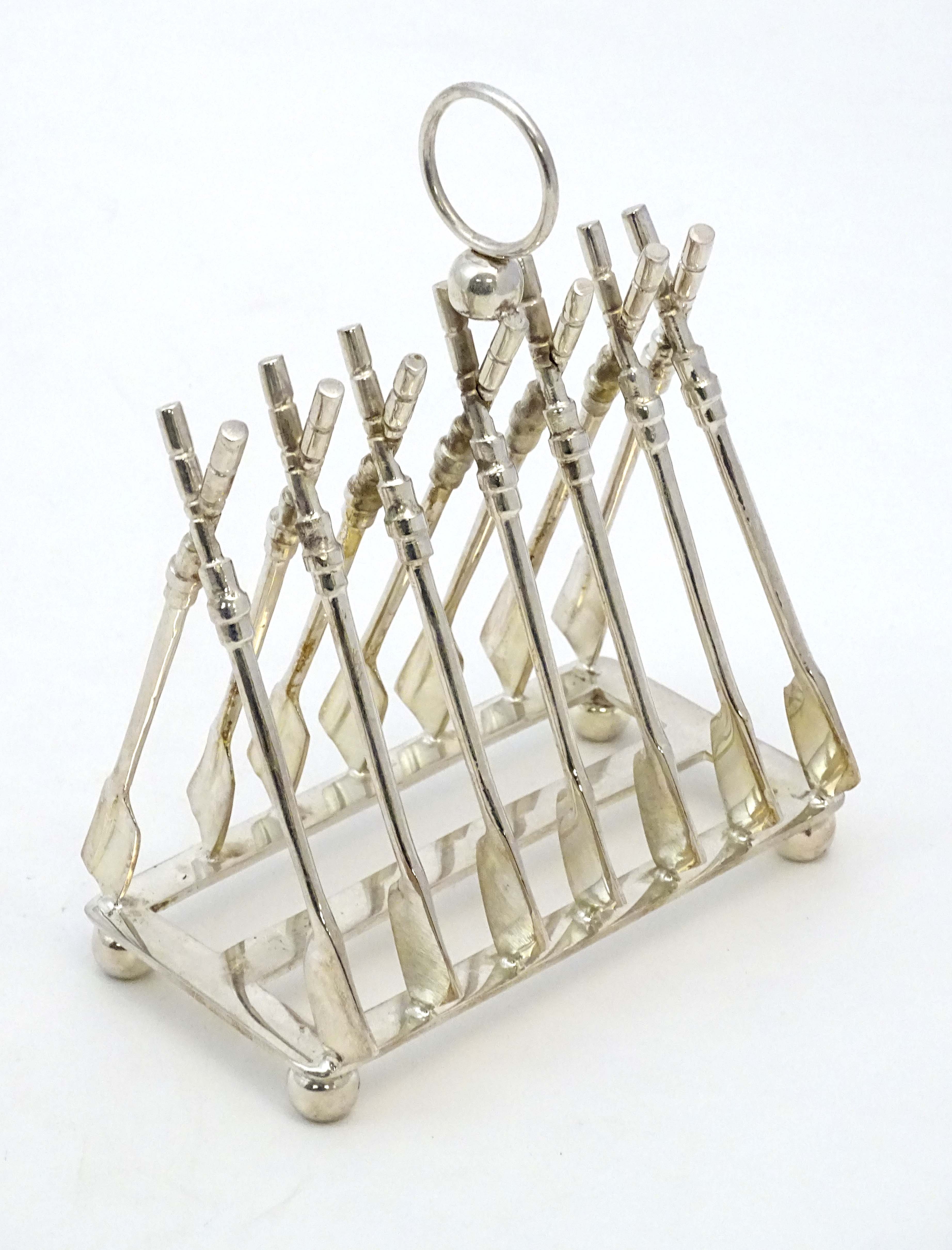 Rowing: A novelty 6-slice silver plated toast rack, the bars formed as oars. - Image 7 of 14