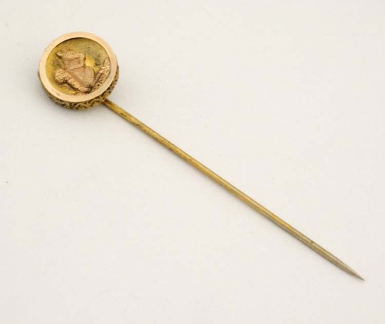 A gilt metal stick pin surmounted by a circular image of a squirrel. - Image 3 of 4