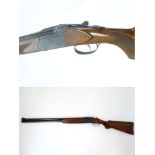 Shotgun : A 12 bore Over & Under boxlock by FAD ,