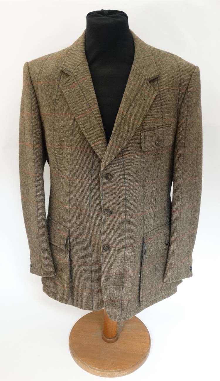 A James Purdey & Sons tweed shooting jacket, approx. 46'' chest measurement.