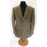 A James Purdey & Sons tweed shooting jacket, approx. 46'' chest measurement.