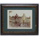 Shooting : A sepia photograph of two Edwardian gentlemen ,