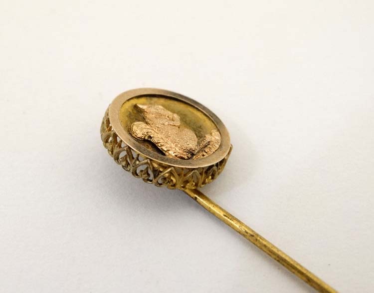 A gilt metal stick pin surmounted by a circular image of a squirrel. - Image 4 of 4