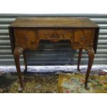 Early to mid 20thC walnut drop flat lowboy with drop leaf sections to either end,