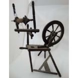 An old spinning wheel stamped 'T.A.D. WILLS No.