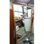 A large over mantle bevelled mirror with gilt frame CONDITION: Please Note - we do