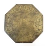 A 20thC octagonal engraved brass sundial base with points of the compass etc.