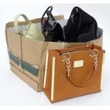 A box of assorted handbags,
